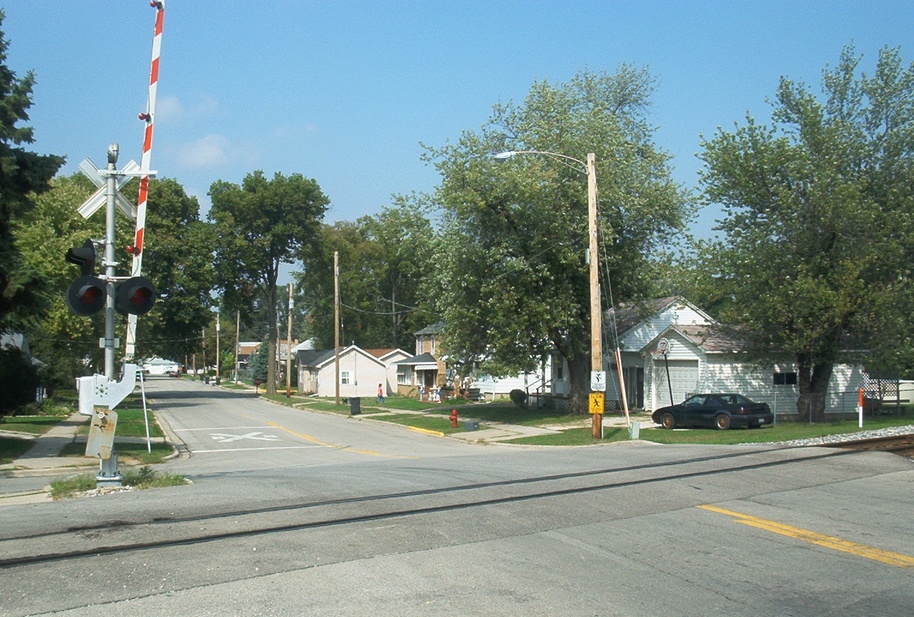 Morris, IL: The railroad tracks and some houses in Morris. Rt. 47 passes over these tracks slightly to the west of where the photograph was taken.
