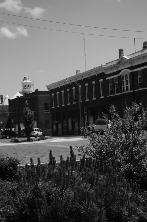 Kingman, KS: Red brick paved streets, store fronts each with their own personality, and a peaceful timeless quality