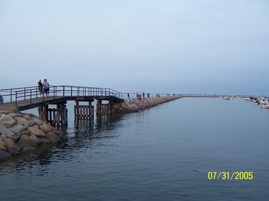 Plymouth, MA: The jetty (breakwater) at Town Warf almost at high tide. The bridge has since been repaired.