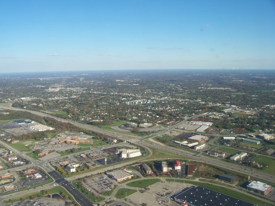 Florence, KY: An aerial shot of the interchange of Turfway Road and I-71/75. The white buildings arranged in a triangle are a Hilton hotel, and to the left, the cluster of orange buildings is St Luke Hospital West.