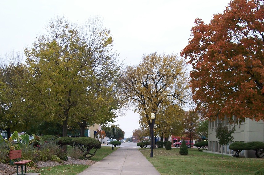 Iola, KS: Courthouse Square Sidewalk. in Iola, KS (facing West Street)