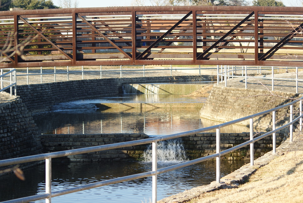Carrollton, TX: water flow under the bridge on the greenbelt in Carrollton