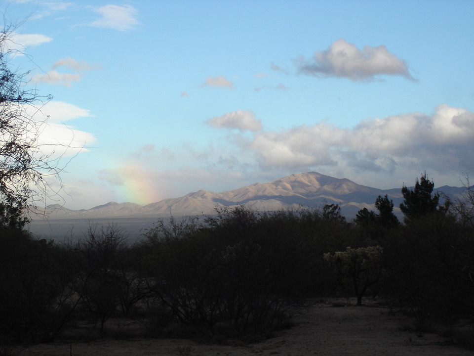 Green Valley, AZ: our view of the Santa Rita's with a slight rainbow.