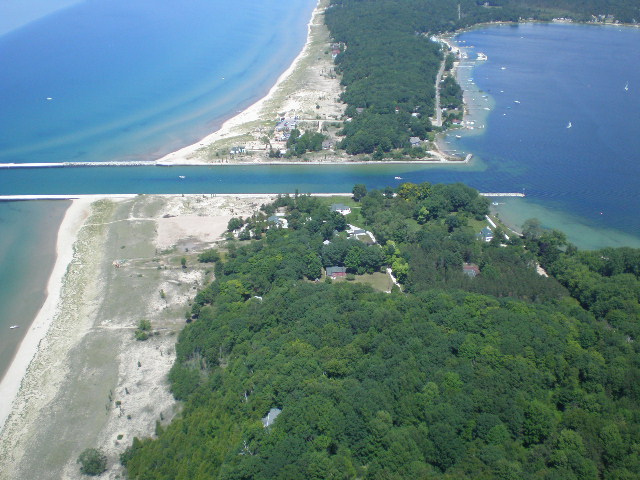 Onekama, MI: 9 Acres for sale on the S side of the channel with LK MI and Portage Lake frontage!!!
