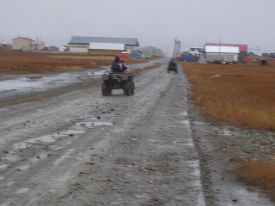 Hooper Bay, AK: Riding back from the airstrip on a wet fall afternoon.