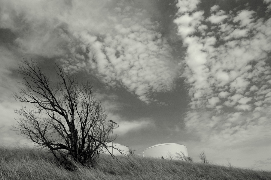 Bartlesville, OK: Tanks on hill with clouds - Bartlesville, OK