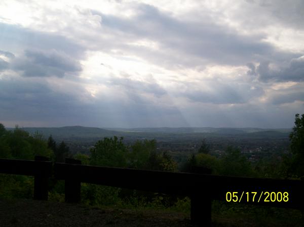 Easthampton, MA: Sun rays shining down on Easthampton from the top of Mt. Tom