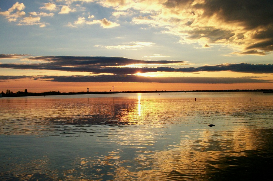 Harrisville, MI: Sunrise on Lake Huron at Harrisville Harbor