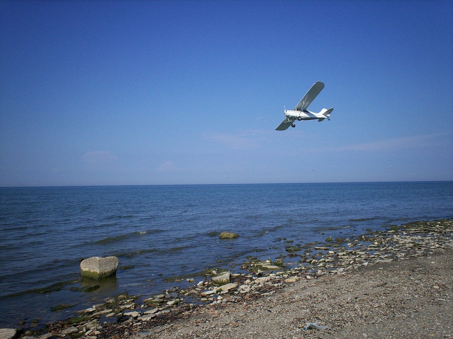 Erie, PA: Plane over lake Erie