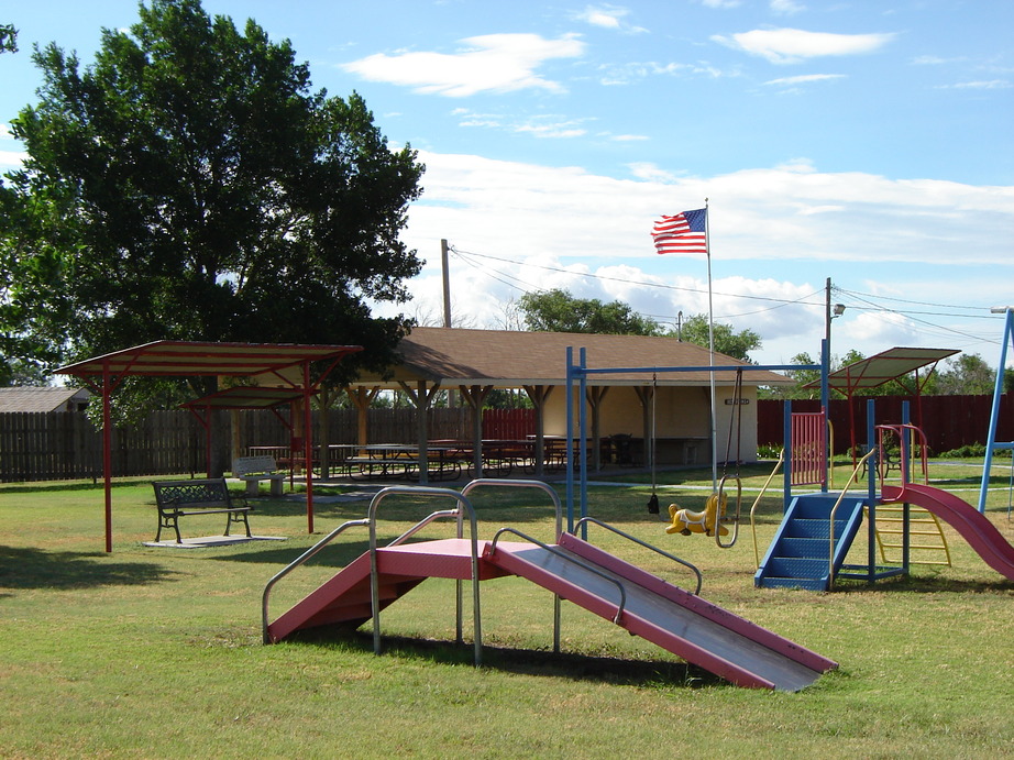 Palco, KS: City Park near the cafe with play equipment and a picnic pavilion which may be reserved for family functions