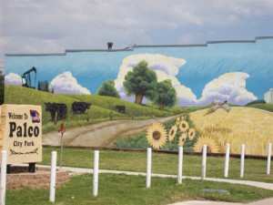 Palco, KS: Another view of the city park showing the mural painted by a young woman artist and former resident who still has relatives in the area