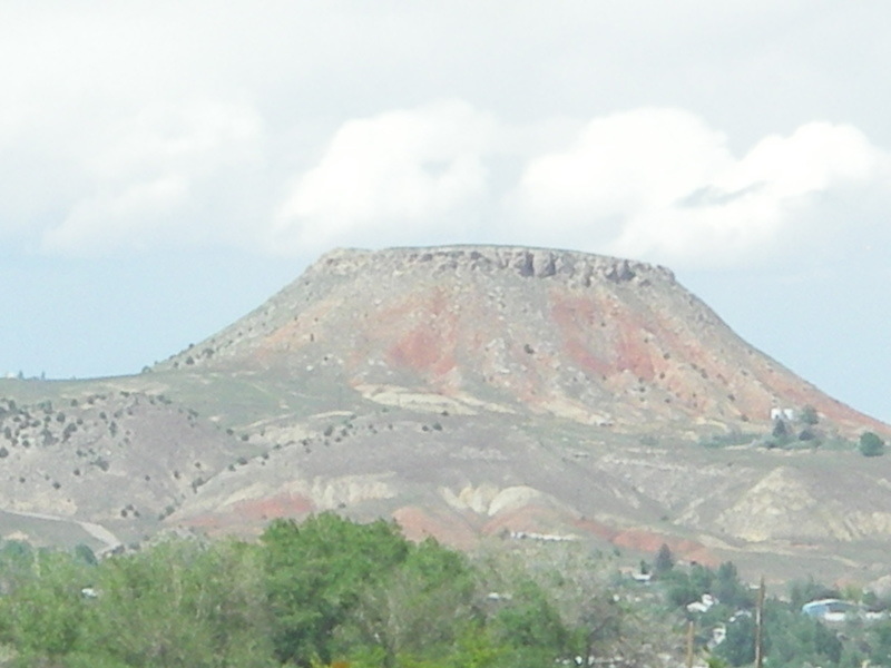 Thermopolis, WY: Round Top Mountain, as you drive north through the red cut south of Thermoplis, you can actually watch this mountain grow as you reach the top of the cut. Round Top proudly stands tall overlooking Thermopolis.