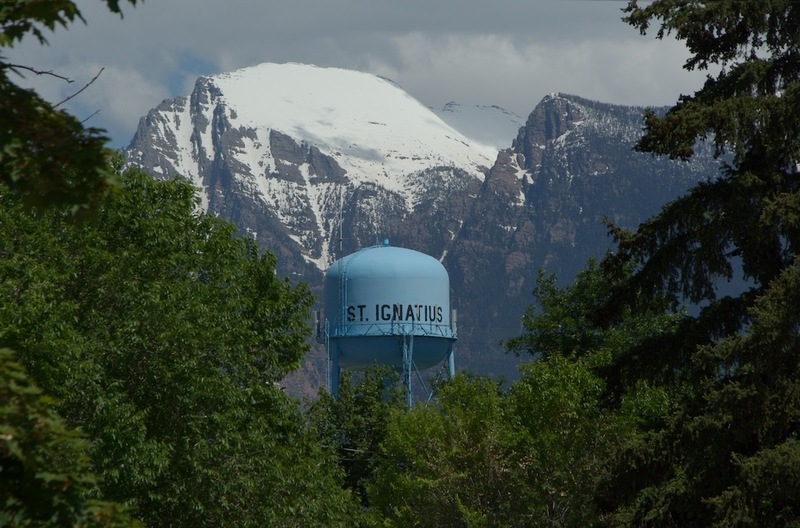 St. Ignatius, MT: St Ignatius, MT water tower with Mission Mountains in background