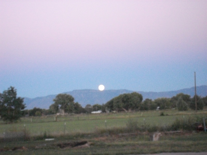 Belen, NM: the sun setting the moon rising the perfect balence.