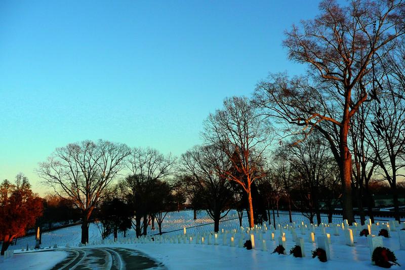 Marietta, GA: The rolling hills & headstones of Marietta National Cemetery, covered in ice and snow.