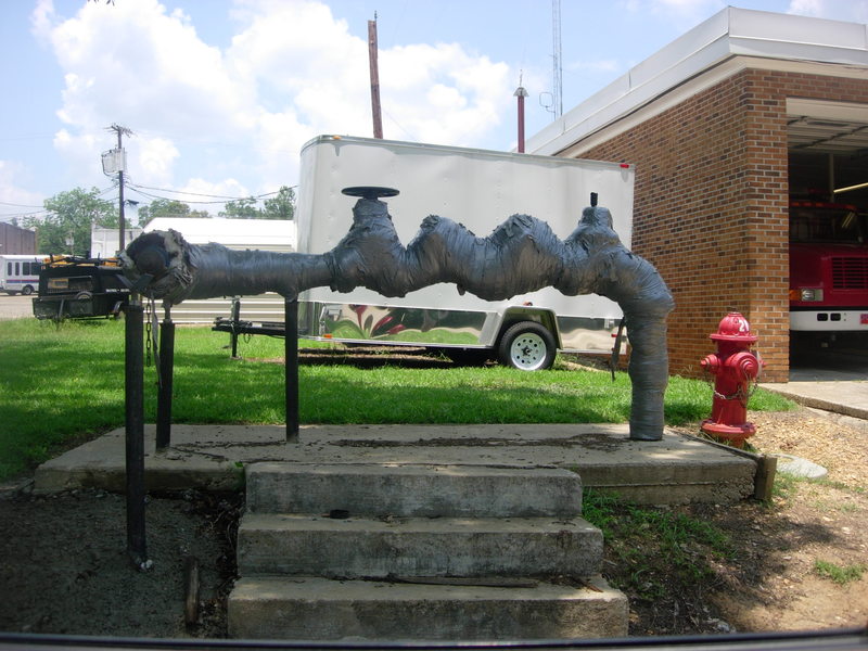 Prentiss, MS: Water pipe in front of in town fire station covered in yes that right duct tape