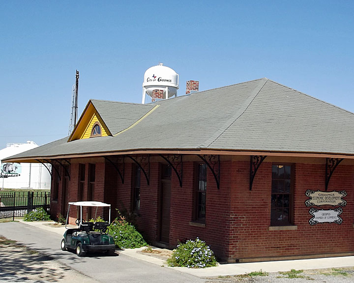 Giddings, TX: Railroad Depot with Water Tower Behind