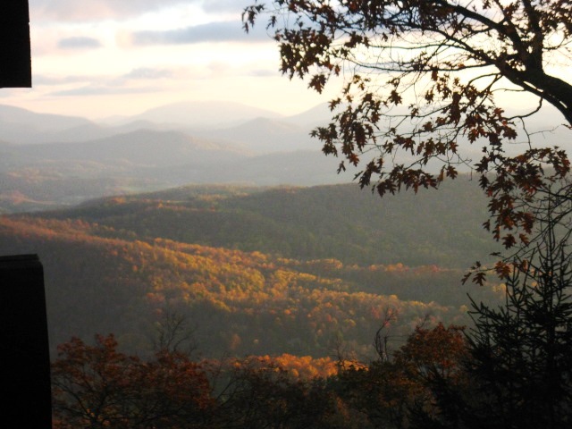 Boone, NC: October 2011, sunrise shining on the mountains of Boone, from Rich Mountain, and Mountain Sunrise cabin...