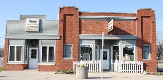 Woodburn, IN: One of our historical buildings, it's been a library, an apartment and now it houses our flower shop and insurance business.