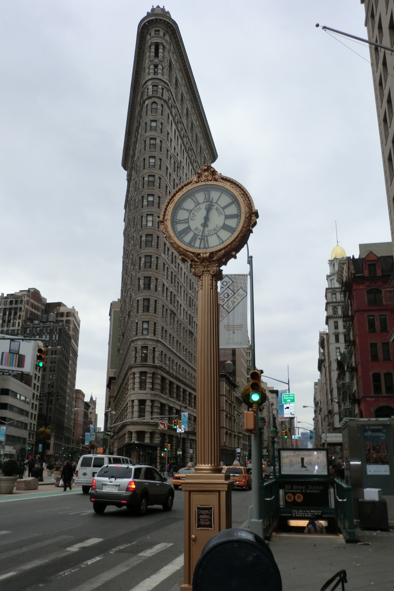 Manhattan, NY: Fifth Avenue Building Clock and the Flatiron Building - both landmarks of nyc