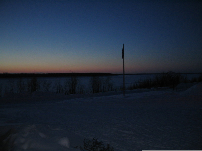 Nulato, AK: Nulato School Flagpole and the Yukon, just before a midmorning sunrise
