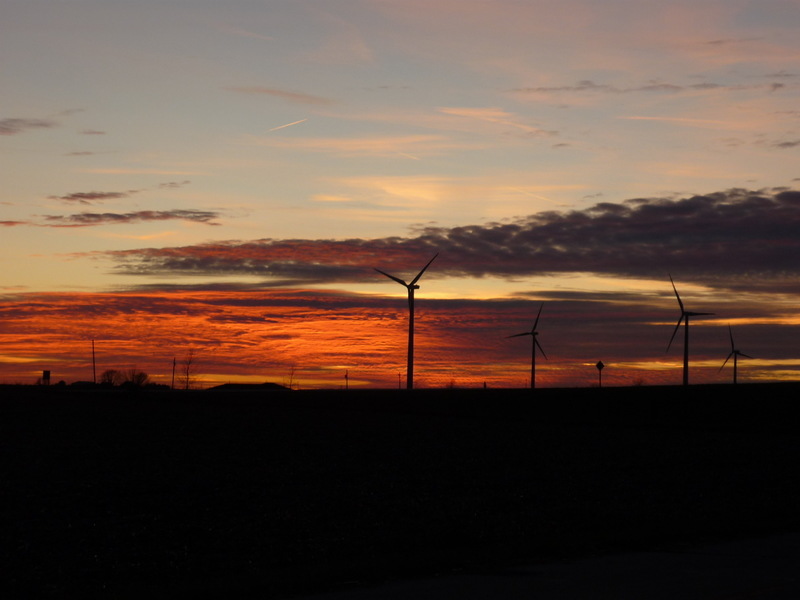 Delavan, IL: Sunset with windmills in the country just west of town