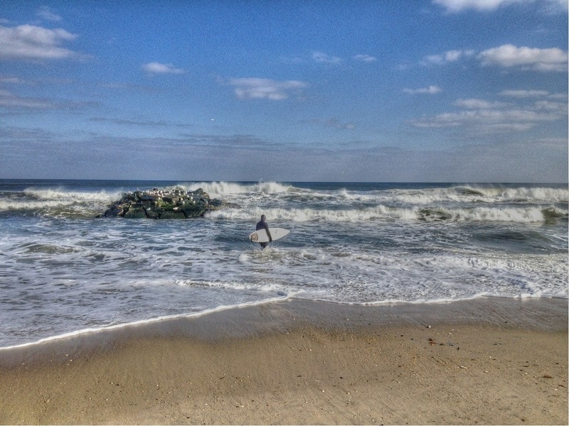 Belmar, NJ: A surfer on the beach in Belmar, New Jersey, February 24, 2013. (c)Michele Ford.