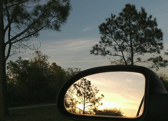Hitchcock, TX: leaving Jack Brooks Park in Hitchcock Texas with sunset in mirror. April 2013