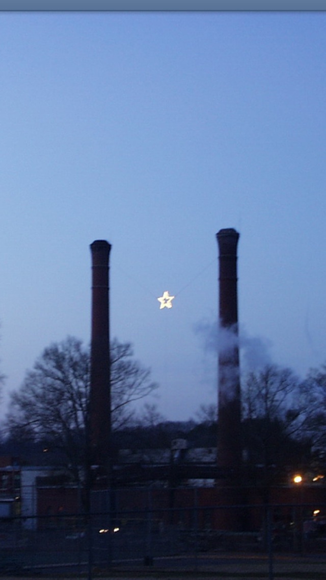 Lindale, GA: Lindale Mill's Christmas Star. Built in 1931, and was hung every Christmas between the mills Smokestacks.