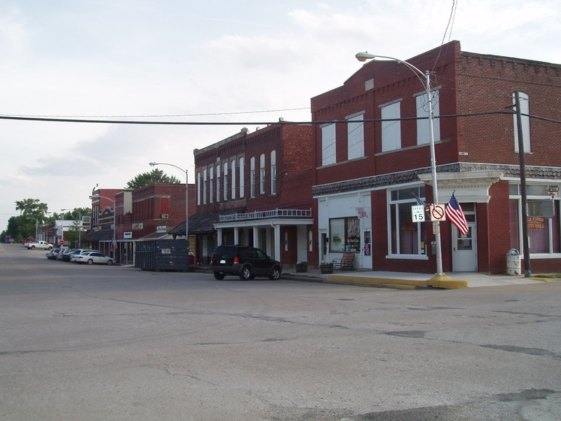 La Plata, MO: Our car parked in front of where my Grandpa John Meeks barbered for years in La Plata, taken 2006