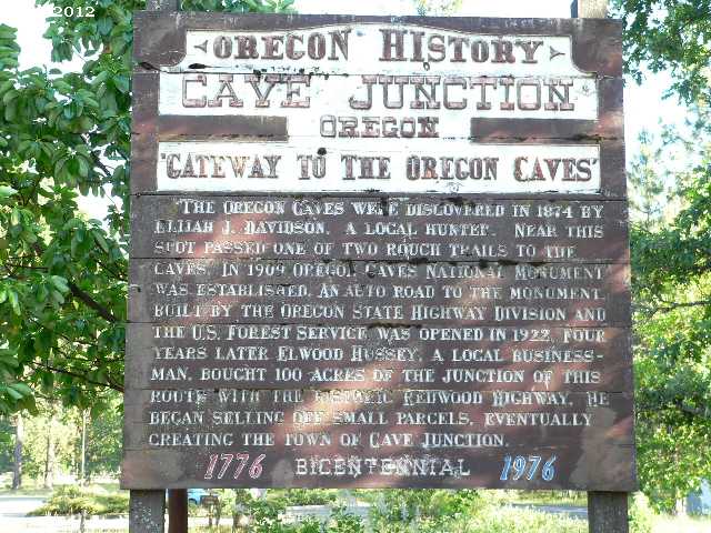 Cave Junction, OR: Cave Junction, Oregon: Old sign telling of the Oregon cave's history.