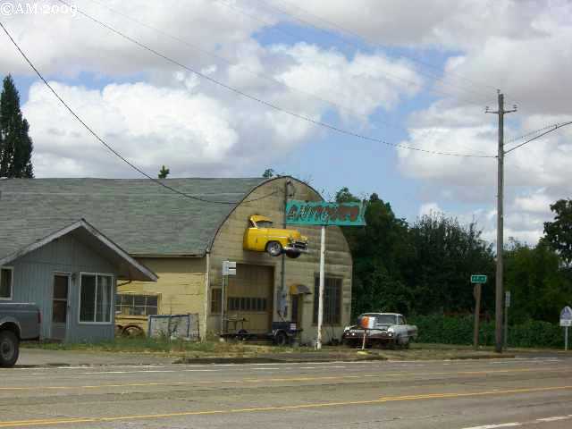 Halsey, OR: Halsey, Oregon: The sign is antique and the car also appears to be an authentic oldie.