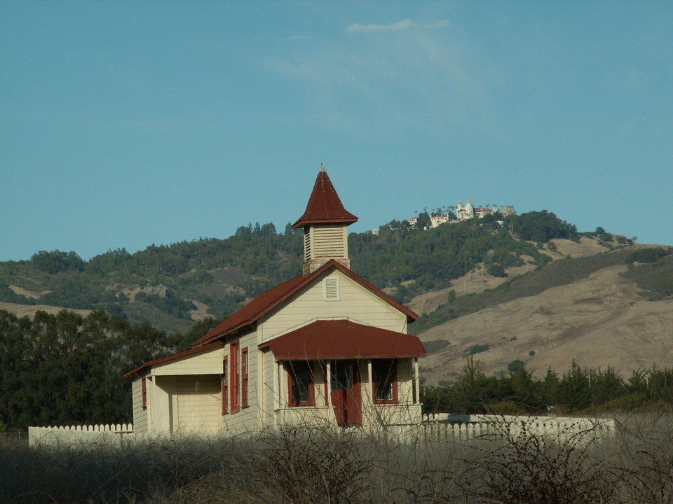 Cambria, CA: Old San Simeon Schoolhouse watched over by Hearst Castle