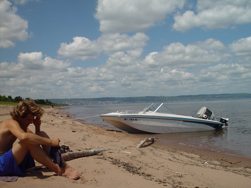 Duluth, MN: Boat on Park Point beach. Jordan Riesgraf contemplating on jumping in despite the frigid water temperatures ; )