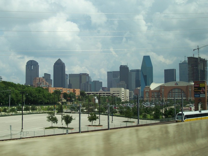 Dallas, TX: Downtown from I-35E. The American Airlines Center is at the right center and the DART tarin is below it.