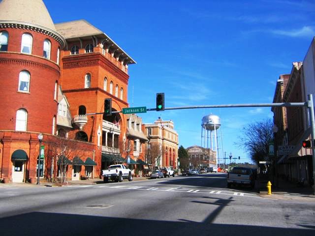 Americus, GA: Downtown Americus looking East with Windsor Hotel, Old Post Office, and City Water Tower in view
