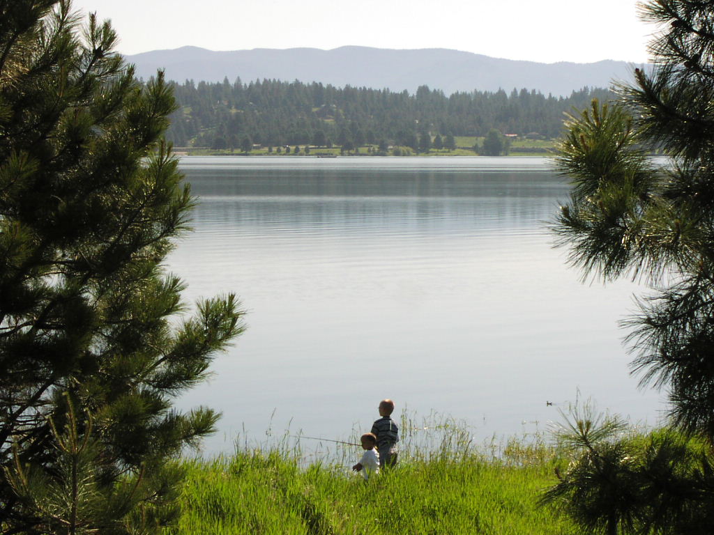 Cascade, ID: Boys on West Mountain fishing. Cascade is across the lake.