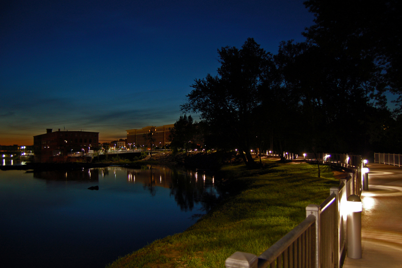 Winooski, VT: The town of Winooski at dusk, looking over the Winooski River
