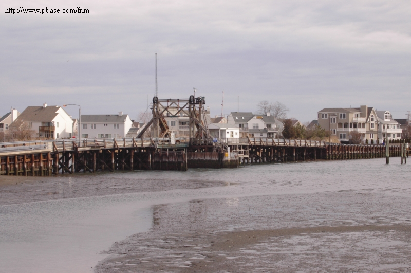 Brielle, NJ: Glimmer Glass Drawbridge 108-year old, wooden-framed drawbridge. Only one of its kind in NJ. A bascule bridge- a French design (1890's)-that uses rolling counterweights at one end to cause the other end to pivot.