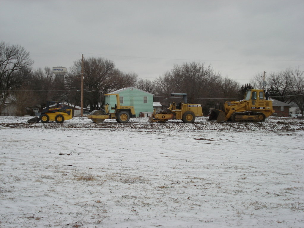 Emporia, KS: Tractors lined up at an apartment complex construction site.
