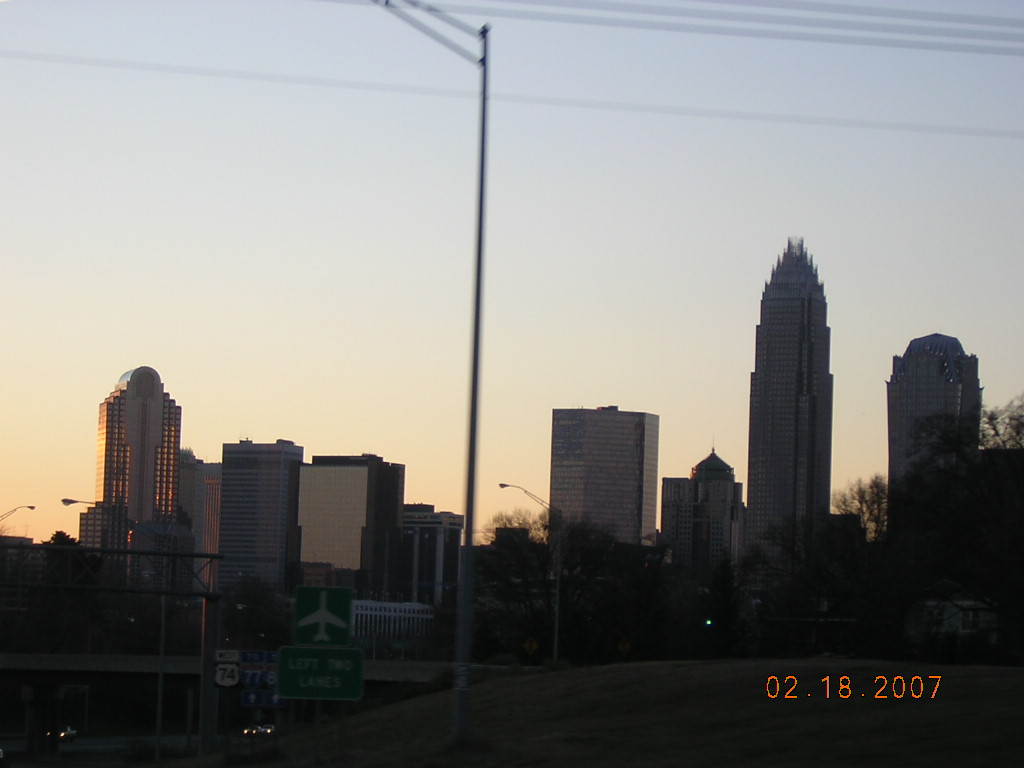 Charlotte, NC: Sundown on Charlotte skyline as viewed from East Independence Blvd.