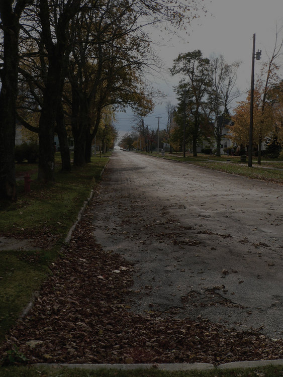 Manistique, MI: View down empty street in Manistique, MI