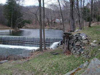 Guilford, VT: Green River Dam, built in the mid-1800s, it belonged to the Green River Paper Mill until the mill burned down in the late 1800s. It is located about 50 feet north of the covered bridge.