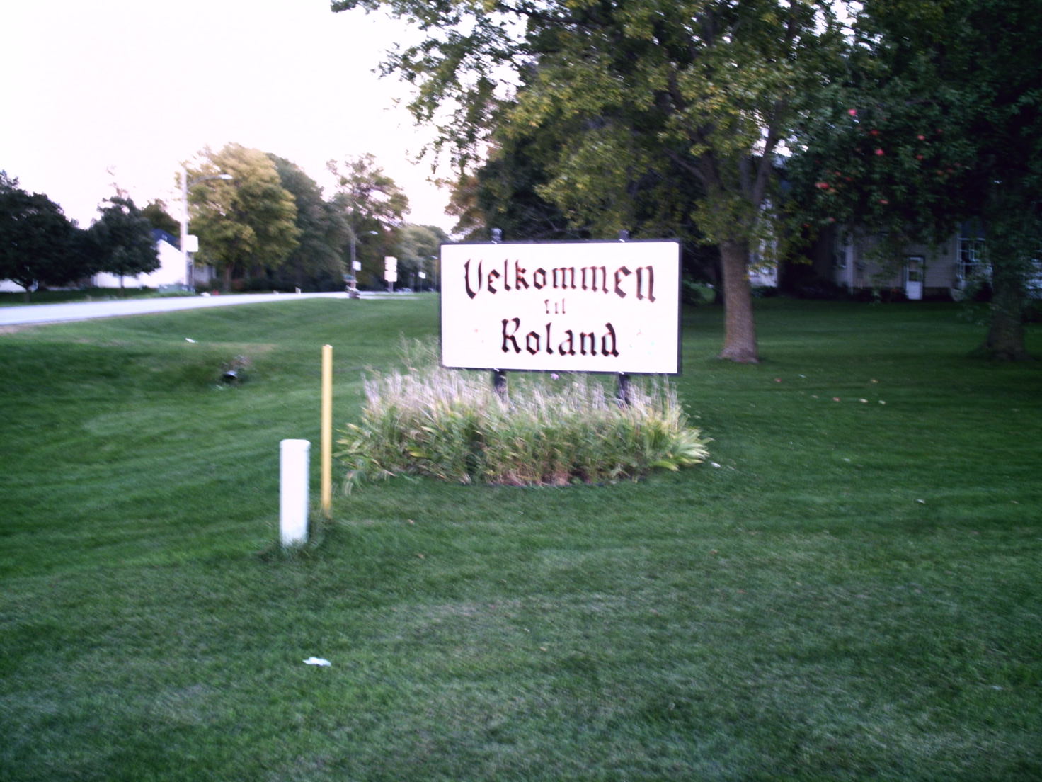 Roland, IA: Sign on Highway 221.