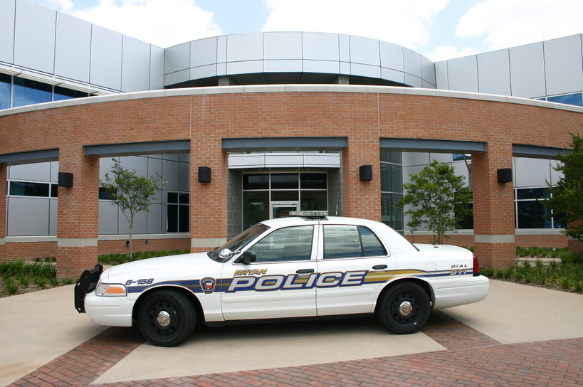 Bryan, TX: Bryan Criminal Justice Center with patrol car