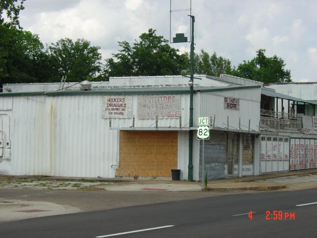 Texarkana, TX: This is one of the many buildings on 7th street just west of State line. The sign says it all! This isn't a pleasant place.