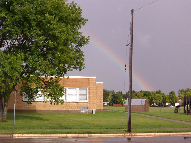 Crookston, MN: Rainbow after thunderstorm over Lincoln School on August 29, 2004