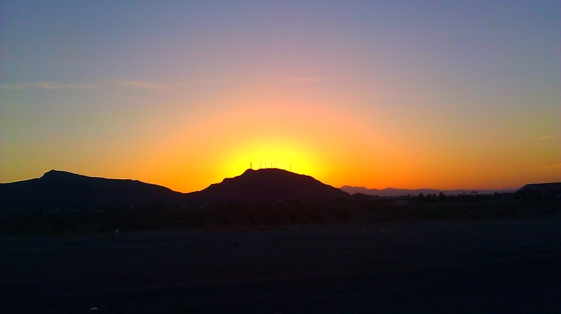 Henderson, NV: sunset behind black mountain