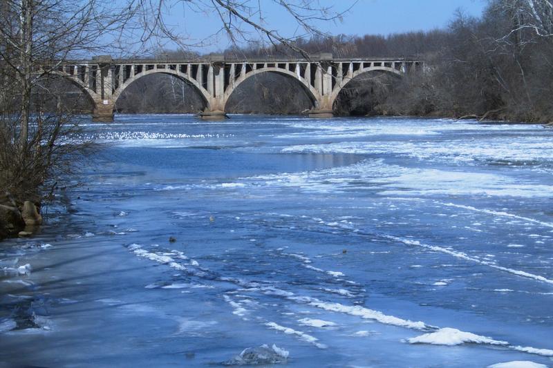 Fredericksburg, VA: Old railroad bridge across the Rappahanock, Fredericksburg in Winter.