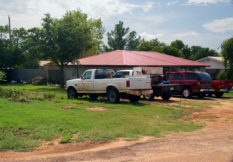 Turkey, TX: WORKING HOUSEHOLD surrounded by working trucks. Turkey is situated at the intersection of State Highways 86 and 70, on the Burlington Northern line in the southwestern corner of Hall County.